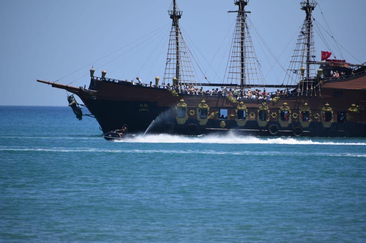 The galleon on its round of the bay, upper deck packed, Tunisian flag astern