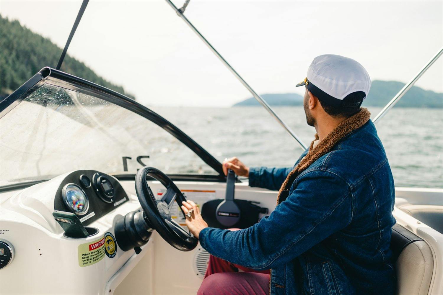 Skipper at the helm, looking out to sea